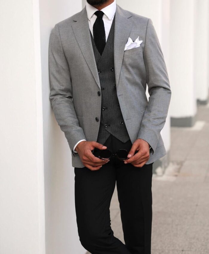 Rennie Street <p>Slim fit mixed light grey suit with herringbone waistcoat</p>

