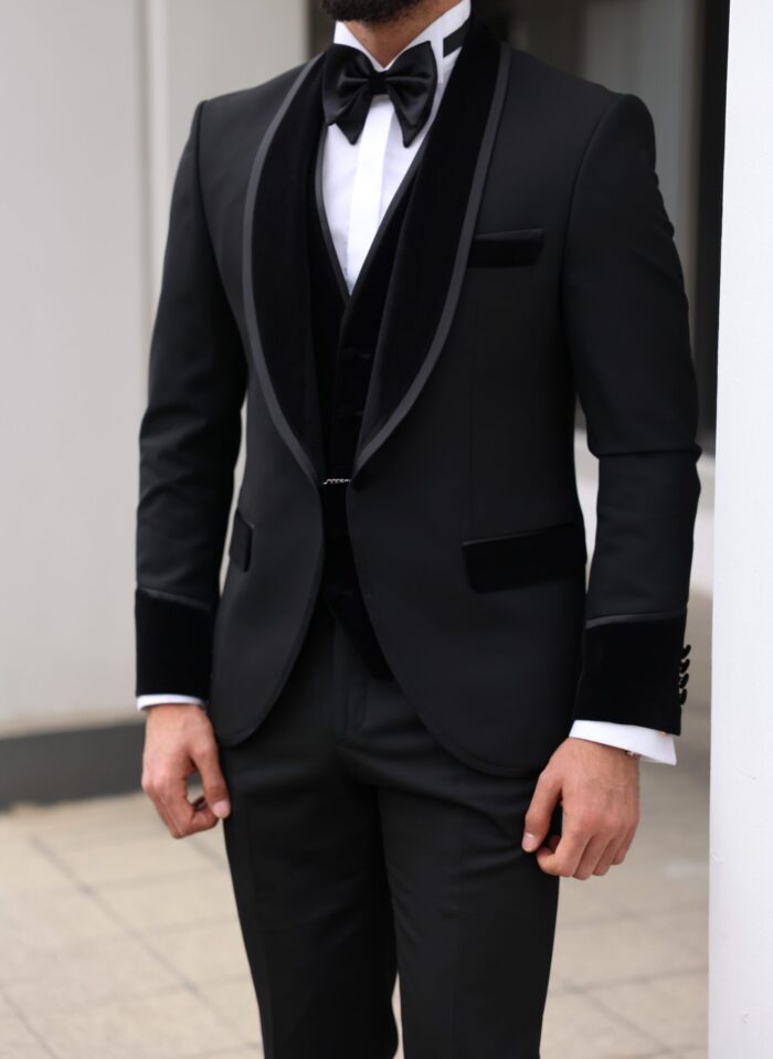 Churchill <p>Slim fit all black three piece men’s tuxedo suit with peak velvet lapels</p>