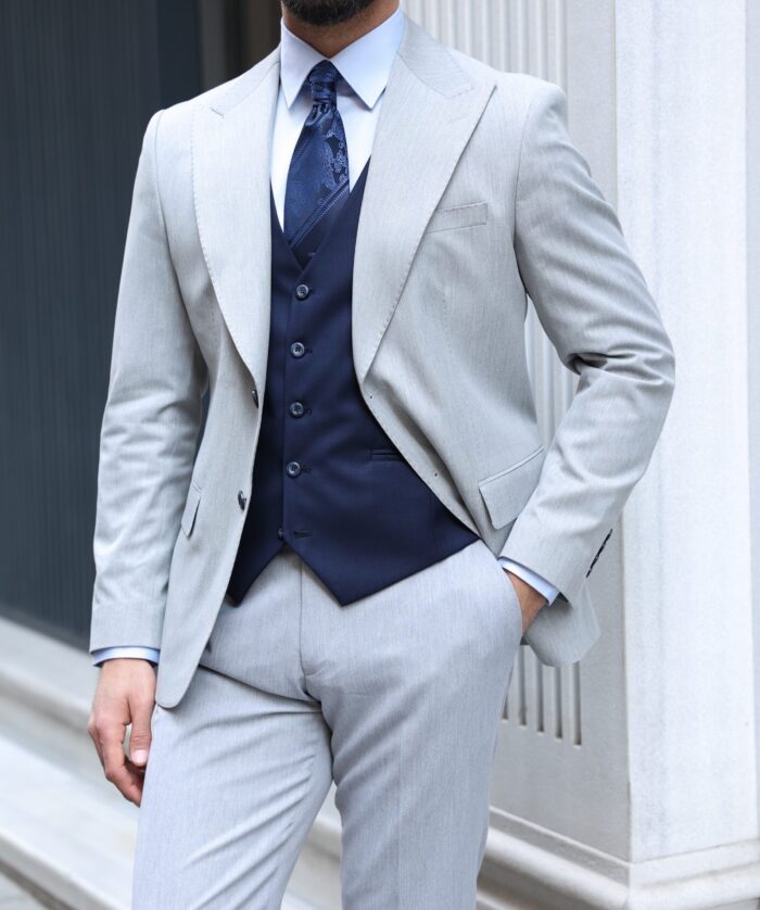Bingham Street <p>Slim fit grey and navy mixed three piece suit with peak lapels</p>
