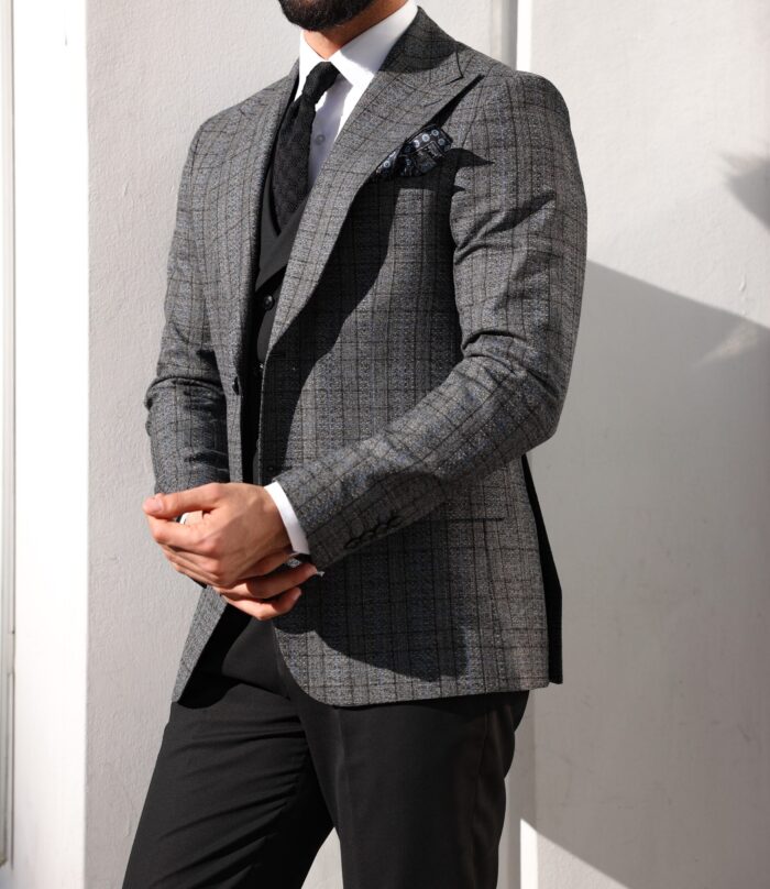 Crown Works Slim fit dark grey and black chequered mixed three piece suit with a double breasted waistcoat and peak lapels