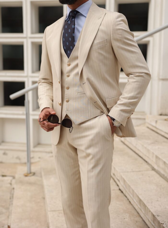 Ellerslie Road Slim fit cream pinstripe three piece suit with peak lapels and decorative gold buttons