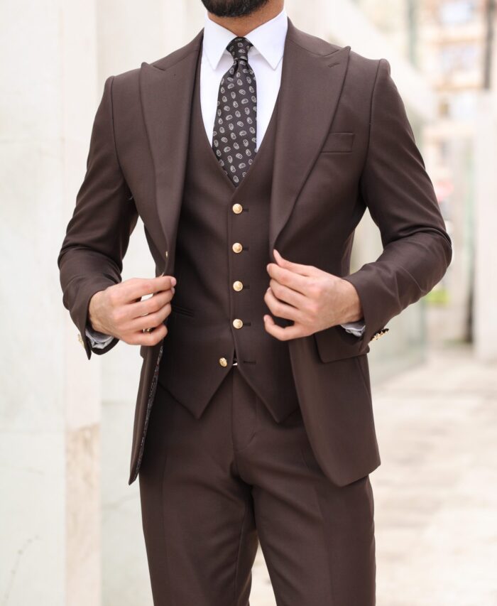 Florio Court <p>Slim fit chocolate brown men’s three piece suit with decorative gold buttons and peak lapels</p>