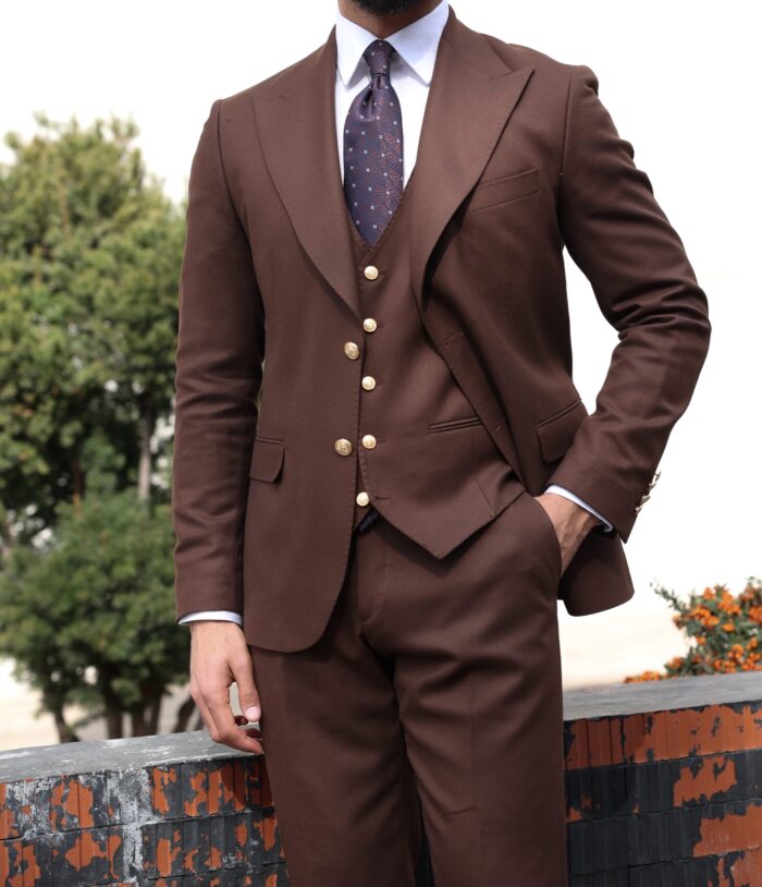 Winkley Street <p>Slim fit chocolate brown men’s three piece suit with decorative gold buttons and peak lapels</p>
