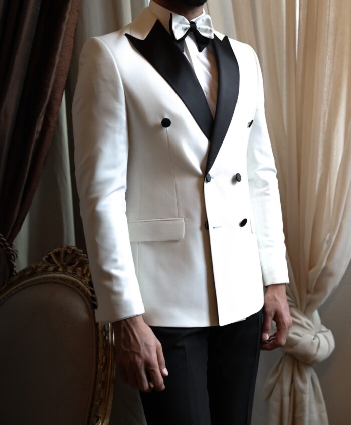 Adrian Tailored slim fit white double breasted men's tuxedo with black satin peak lapels