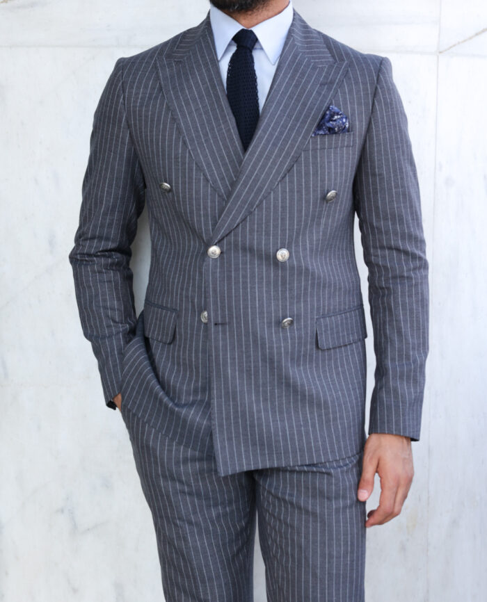 Chimes Close Tailored slim fit light grey pinstripe double breasted two piece suit with peak lapels with decorative silver buttons.