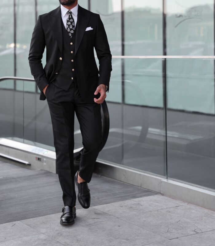 Edmonton SLIM FIT BLACK THREE PIECE MEN’S SUIT WITH PEAK LAPELS WITH decorative gold buttons.