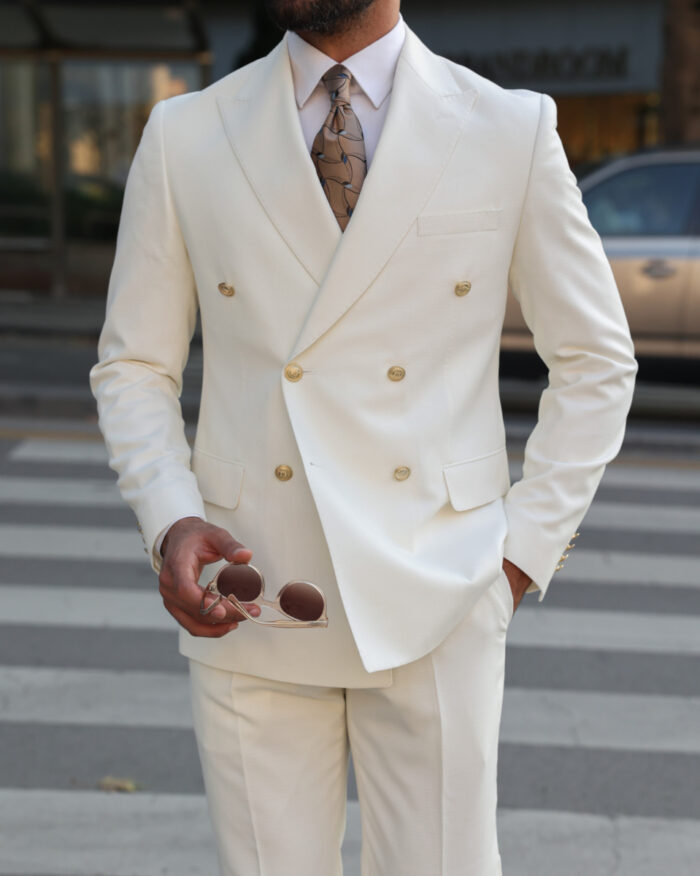 Forest Gate Tailored slim fit ecru double breasted men's suit with peak lapels with decorative gold buttons.
