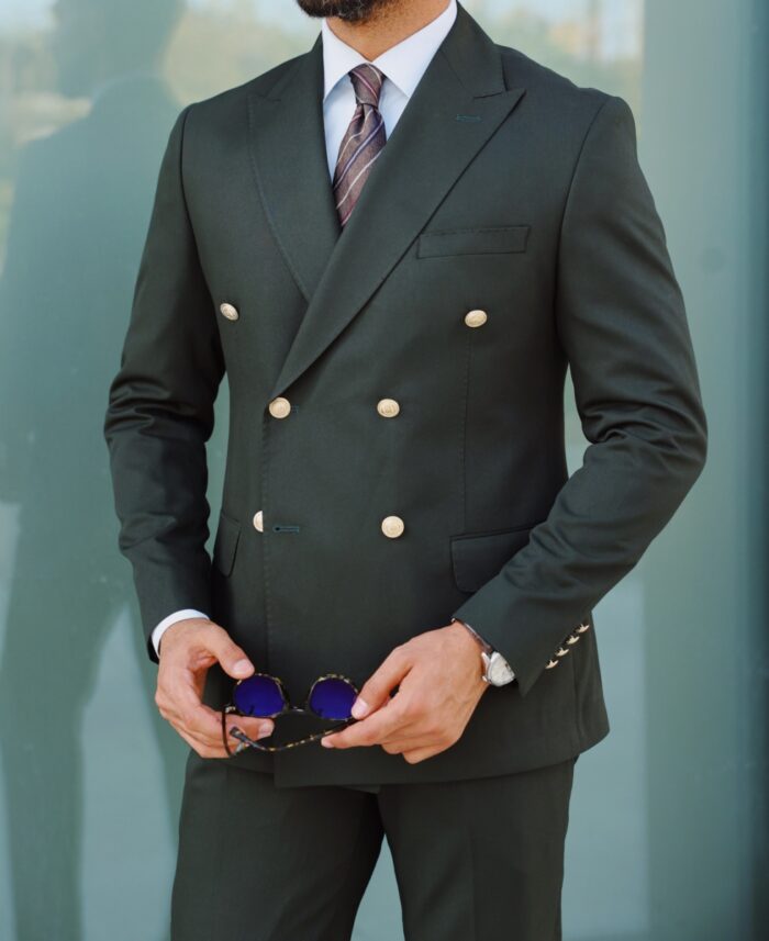 Liners End Tailored slim fit hunter green double breasted men's suit with peak lapels with decorative gold buttons.