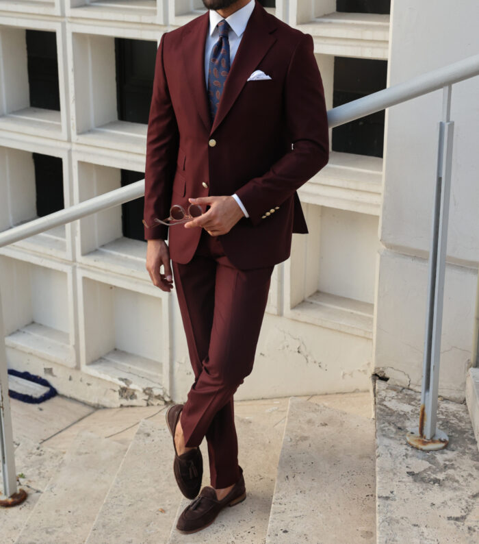 Mead Lane Tailored slim fit crimson red men's two piece suit with peak lapels with decorative gold buttons.
