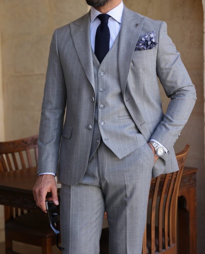 Greycoat Street Slim fit light grey with baby blue pinstripe three piece men's suit with peak lapels