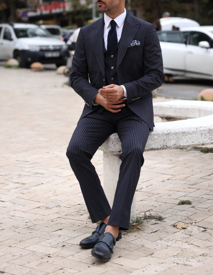 The Plain Slim fit dark blue men’s three piece suit with peak lapels and with decorative silver buttons